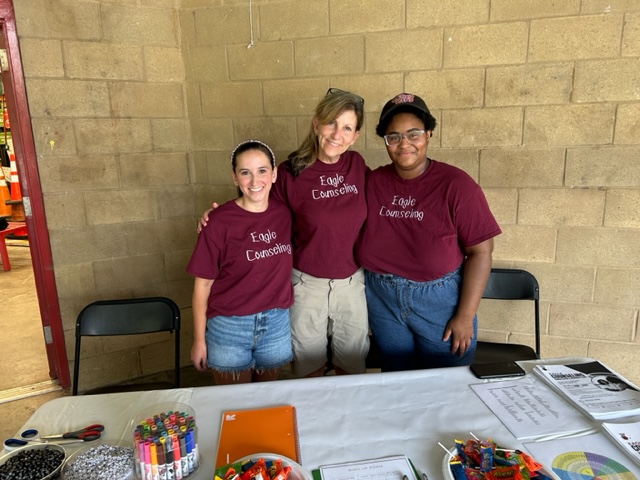 Dr. Lupton-Smith with two students